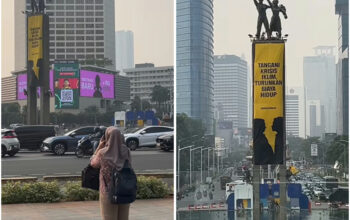 Berani Naik ke Puncak Patung Selamat Datang! Aktivis Greenpeace Bentangkan Spanduk Kritik Biaya Hidup